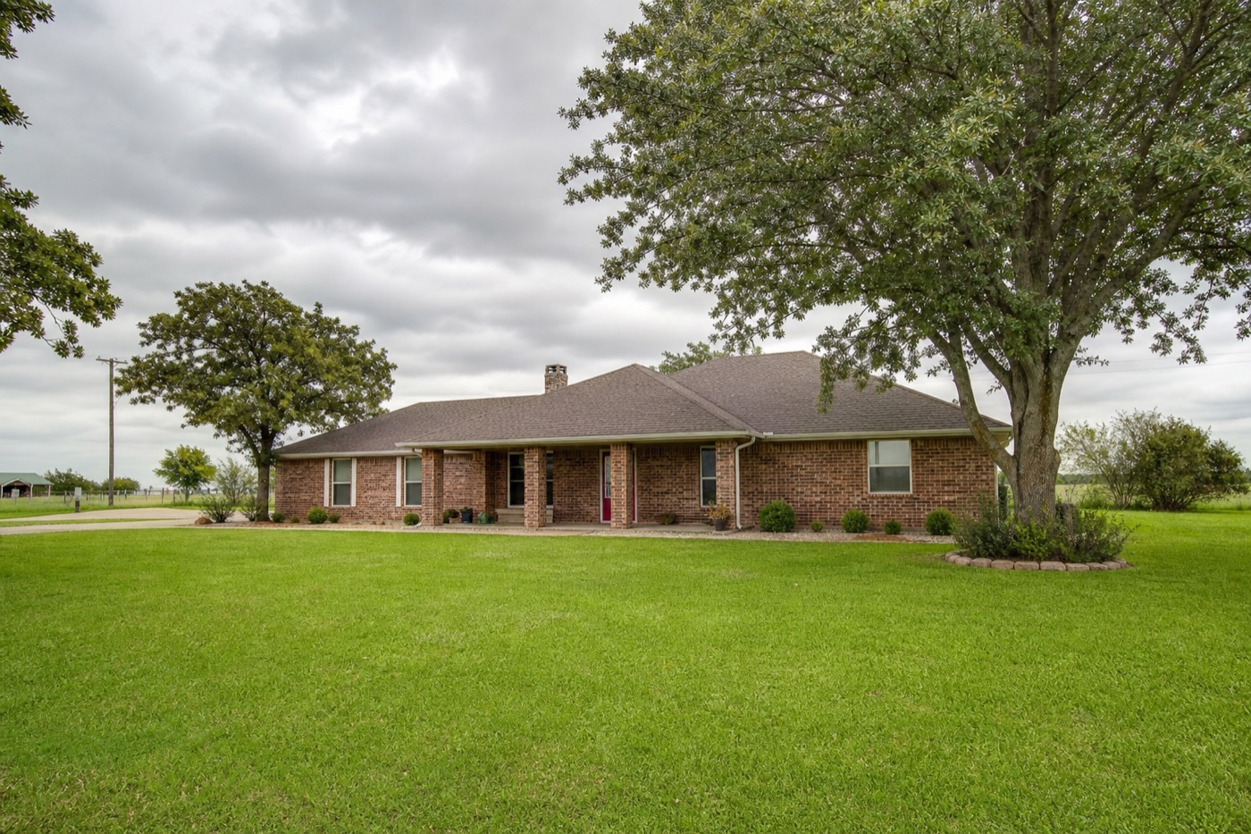 Single-story brick ranch home with front lawn — typical Ellis County, Texas residential style